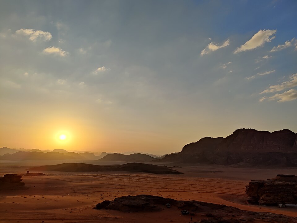 The sun setting over the desert at Wadi Rum